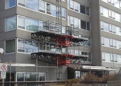 mast climber on side of a building